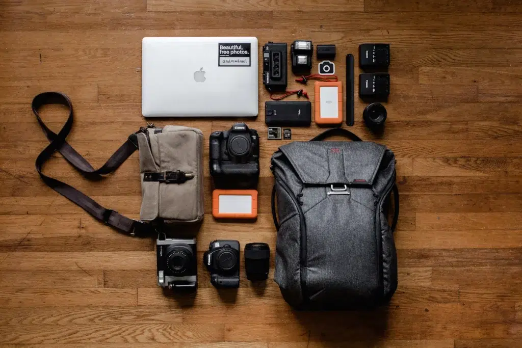 Layout of the best things to pack for digital nomads including a backpack, camera, and more