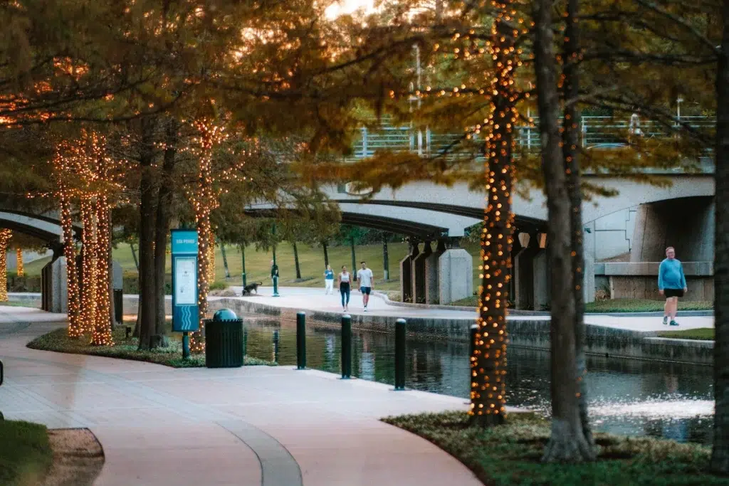 The Woodlands Waterway, Texas with people walking at sunset
