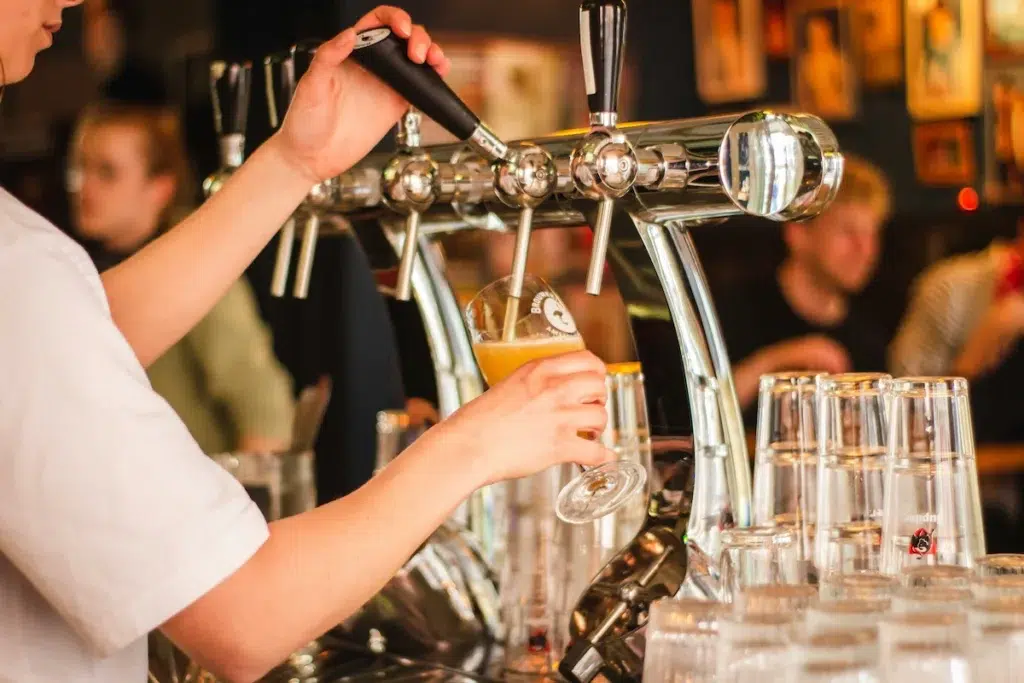 Bartender pouring beer at bar in Bozeman MT