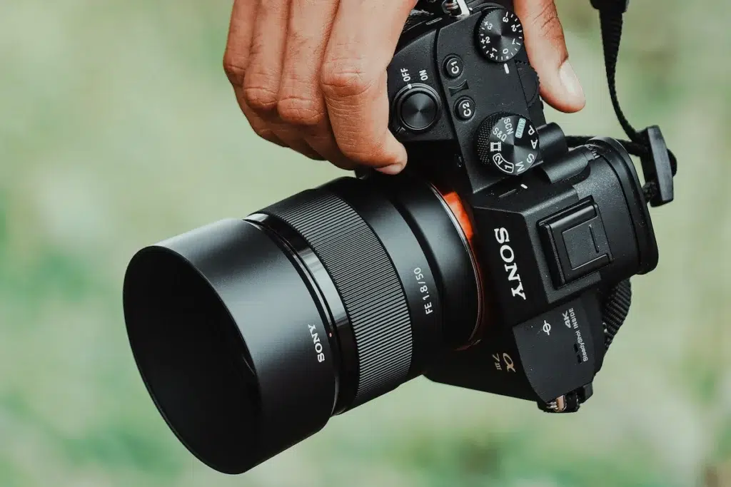 Sony a7iii camera in person's hand